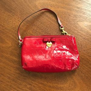 COPY - Red COACH patent wristlet